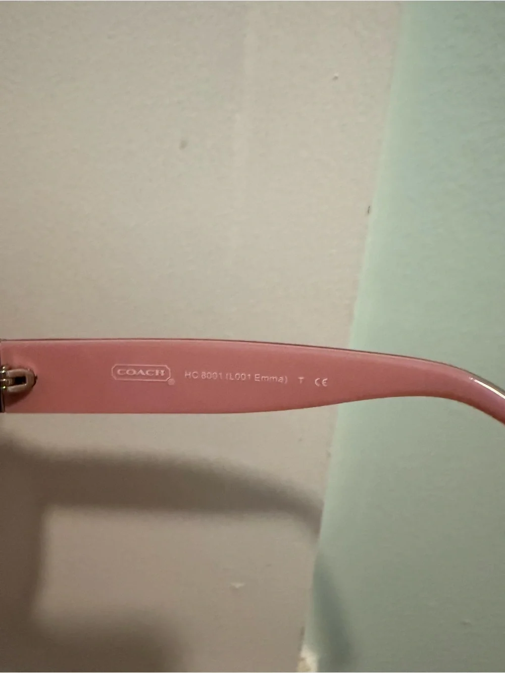 Coach “Emma” Black Logo-Accent Sunglasses with Gold and Pink Details